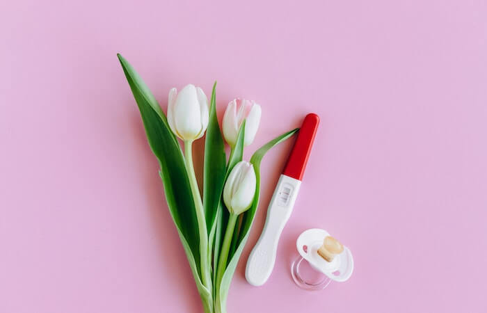 flowers, pregnancy test, and binky - 100 percent accurate ovulation calculator